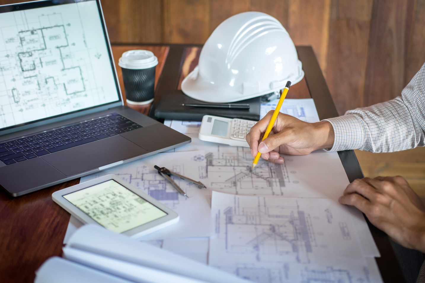 Construction Engineering Working on Blueprint